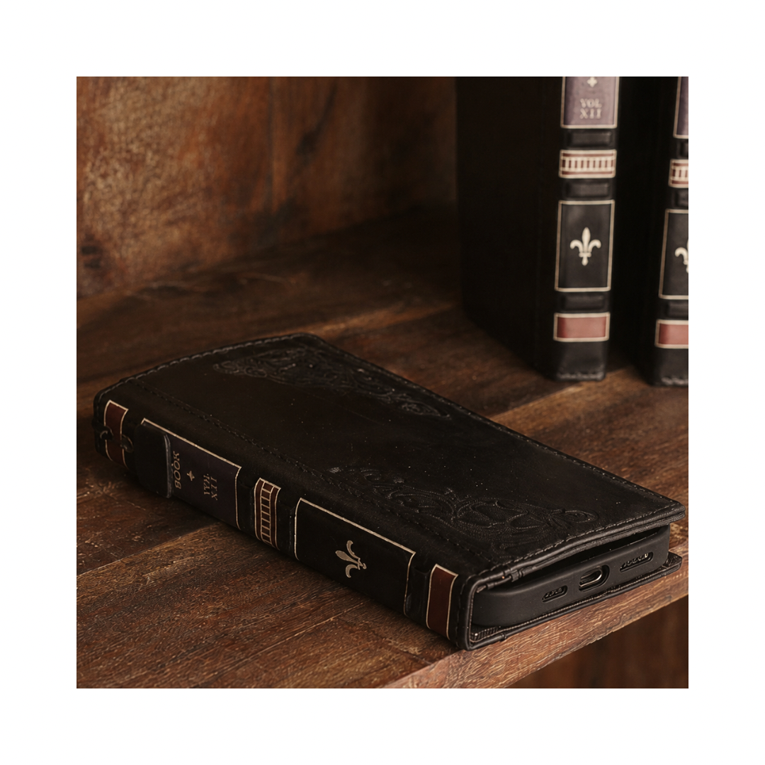Vintage black full grain leather iPhone wallet case with antique book spine and embossed floral details