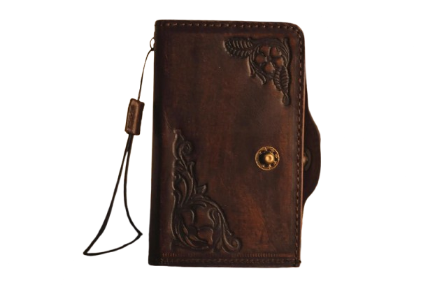 Close-up of hand-tooled floral detailing on full grain leather Z Fold case