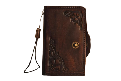 Close-up of hand-tooled floral detailing on full grain leather Z Fold case